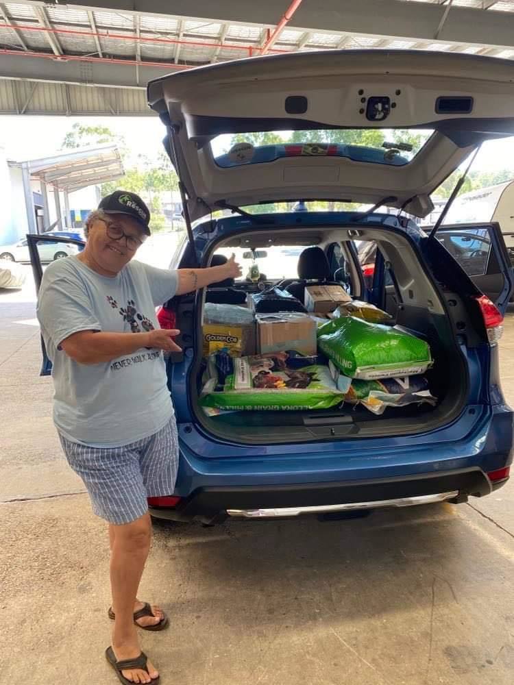 a person with a car load of food
